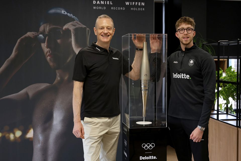Harry Goddard, CEO of Deloitte Ireland and Daniel Wiffen as Deloitte Ireland announced a four-year partnership with the Olympic champion and world-record holder. Photo: Jason Clarke